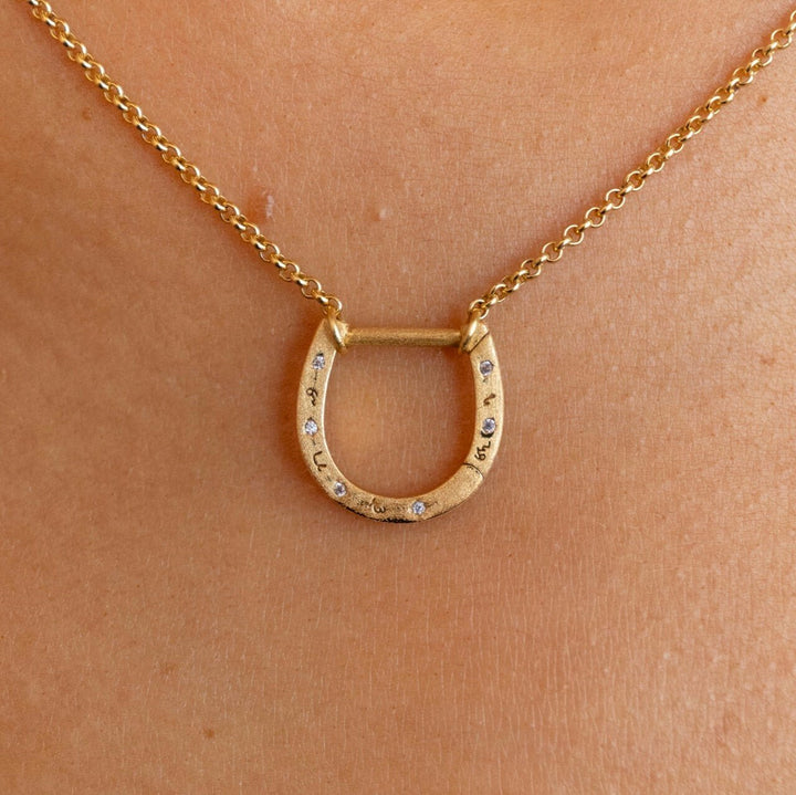 model wears 18k Gold Vermeil and Cubic Zirconia Horseshoe Charm Pendant Necklace - Claire Hill Designs