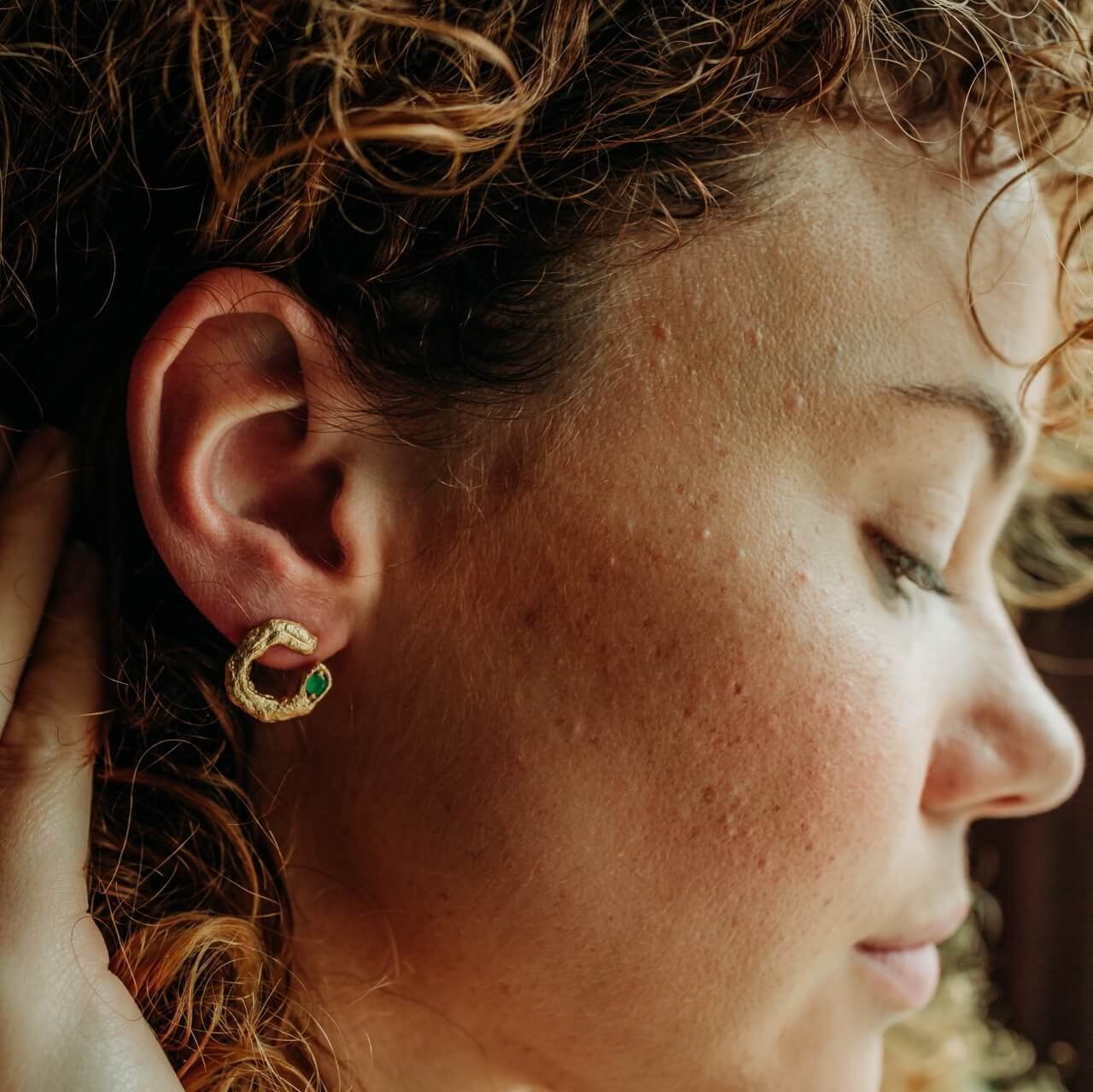 model wears Emerald and 14k Gold Vermeil Asymetric Statement Stud Earrings