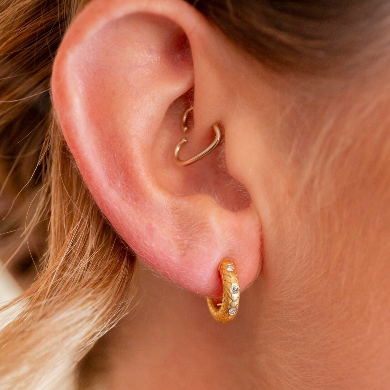 model wears Lab grown diamond and 14k gold vermeil art deco huggie hoop earrings