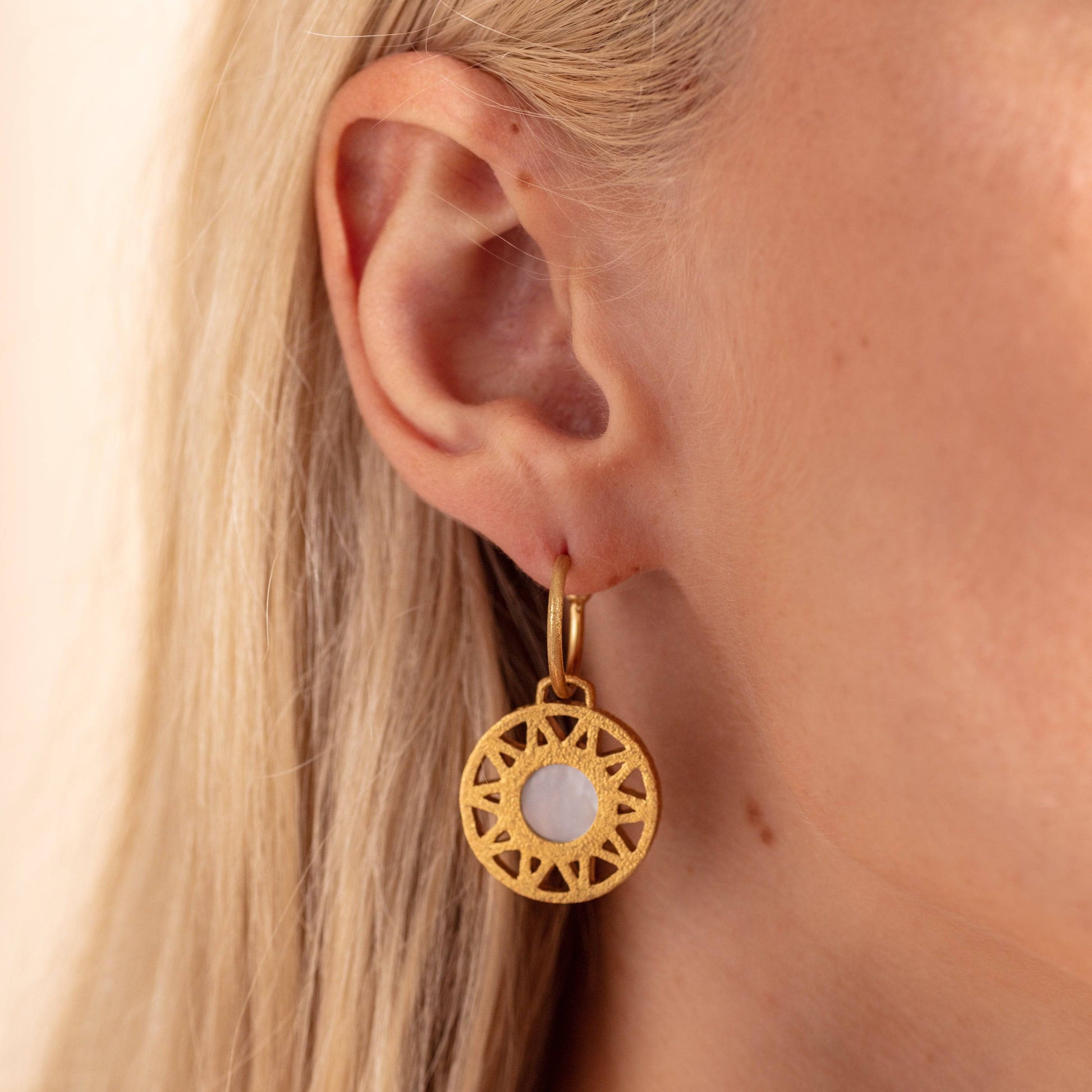 model wears Geometric Mother of Pearl and Gold Statement Hoop Earrings close up