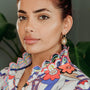 model wears Geometric Mother of Pearl and Gold Statement Hoop Earrings
