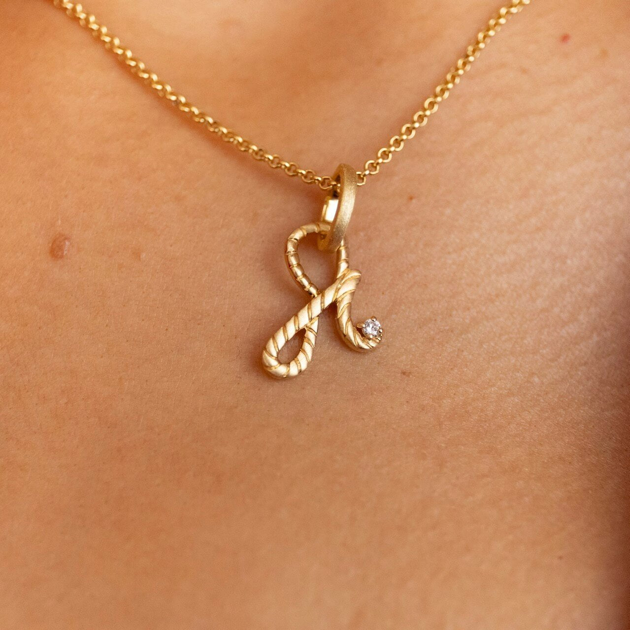 model wears 14k Gold Vermeil Shorthand Charm Necklace meaning Fearless - Claire Hill Designs