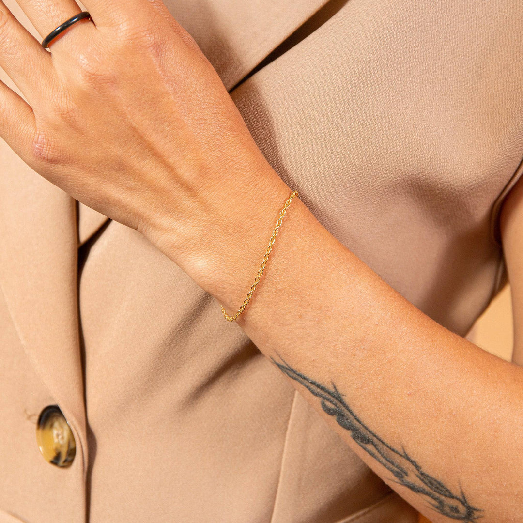 model wears Layered Delicate Gold Chain Bracelet
