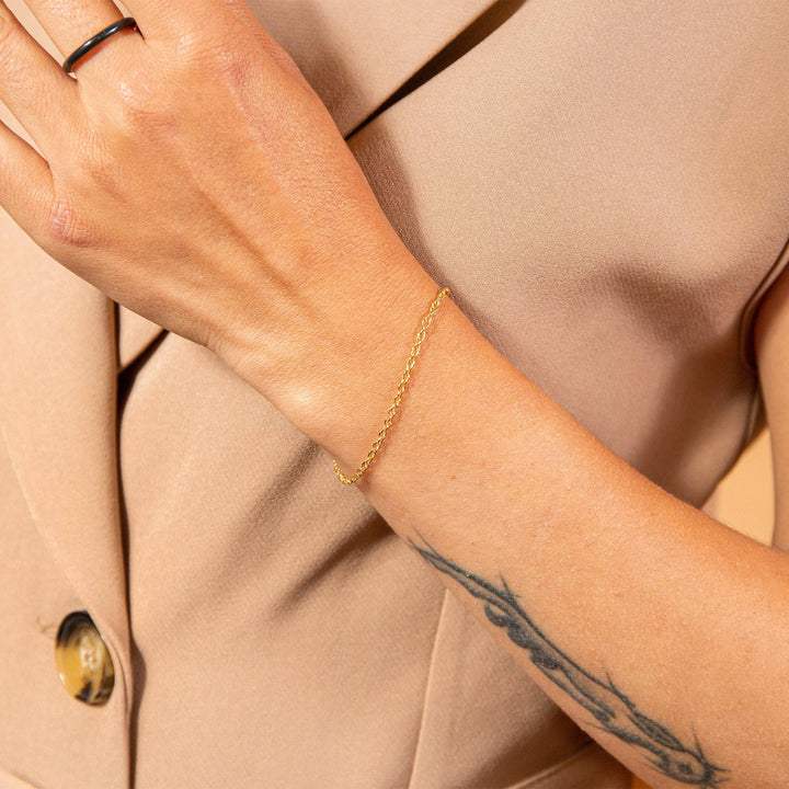 model wears Layered Delicate Gold Chain Bracelet