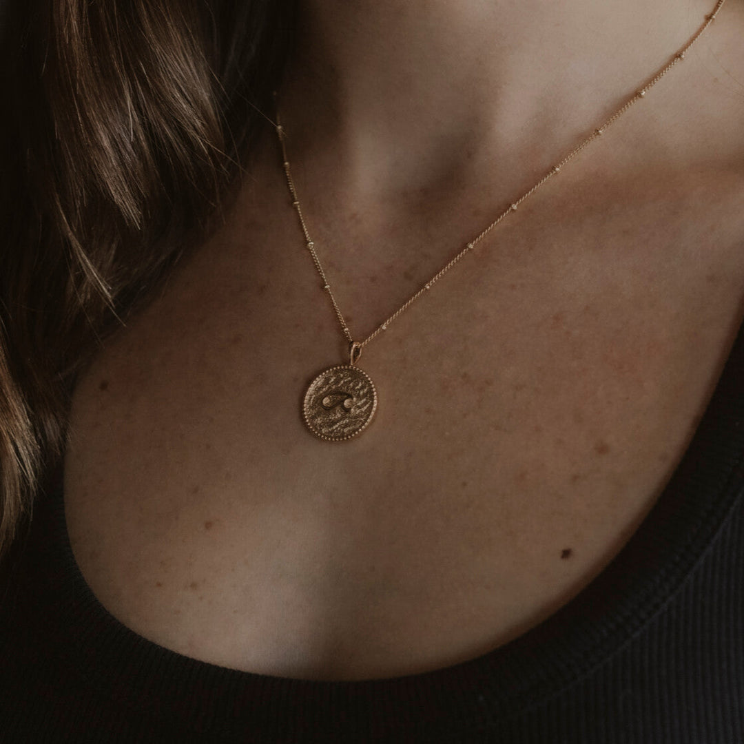 model wears “Fuck” Gold Shorthand Coin Necklace
