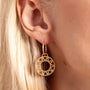 model wears Geometric Statement Gold Hoop Earrings - close up