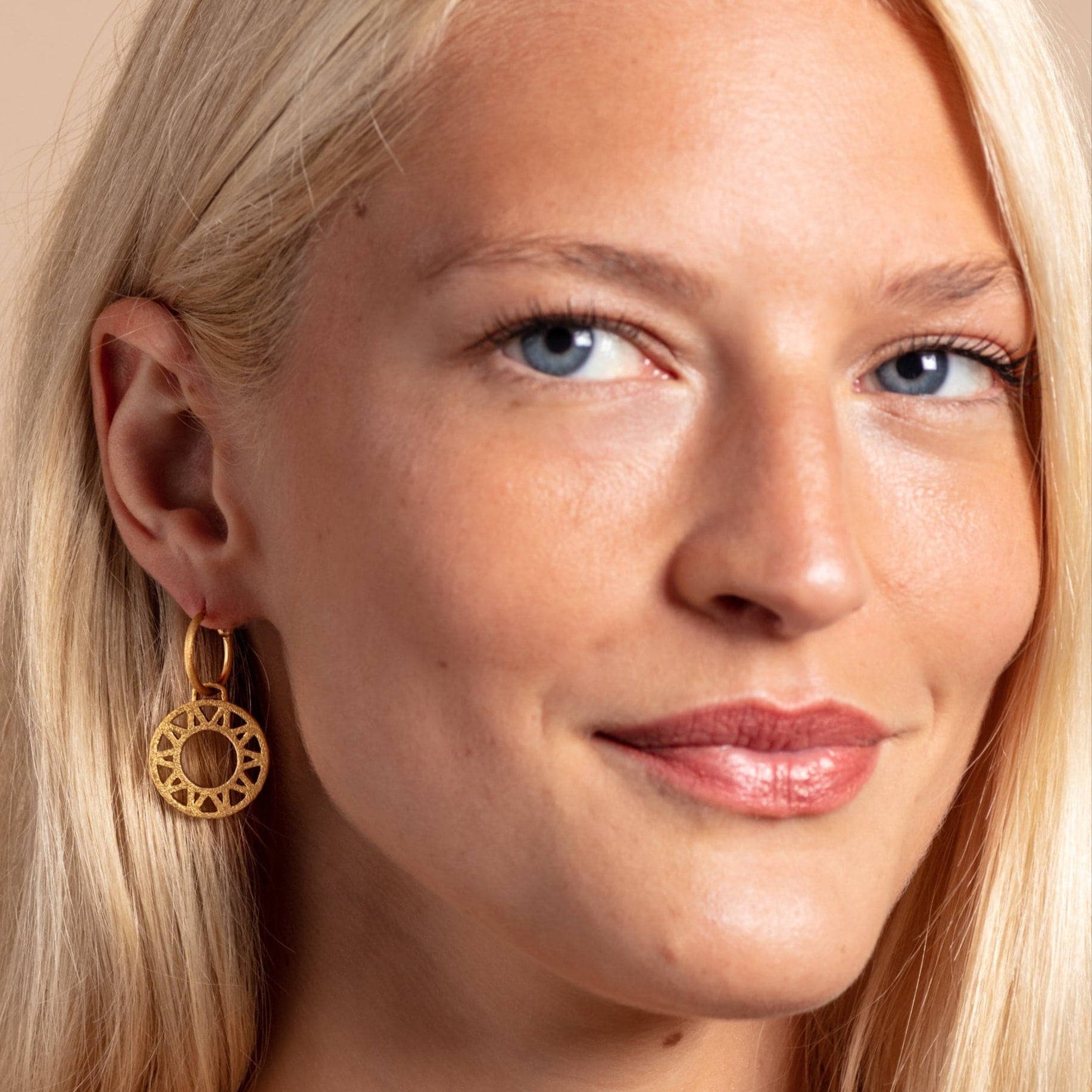 model wears Geometric Statement Gold Hoop Earrings