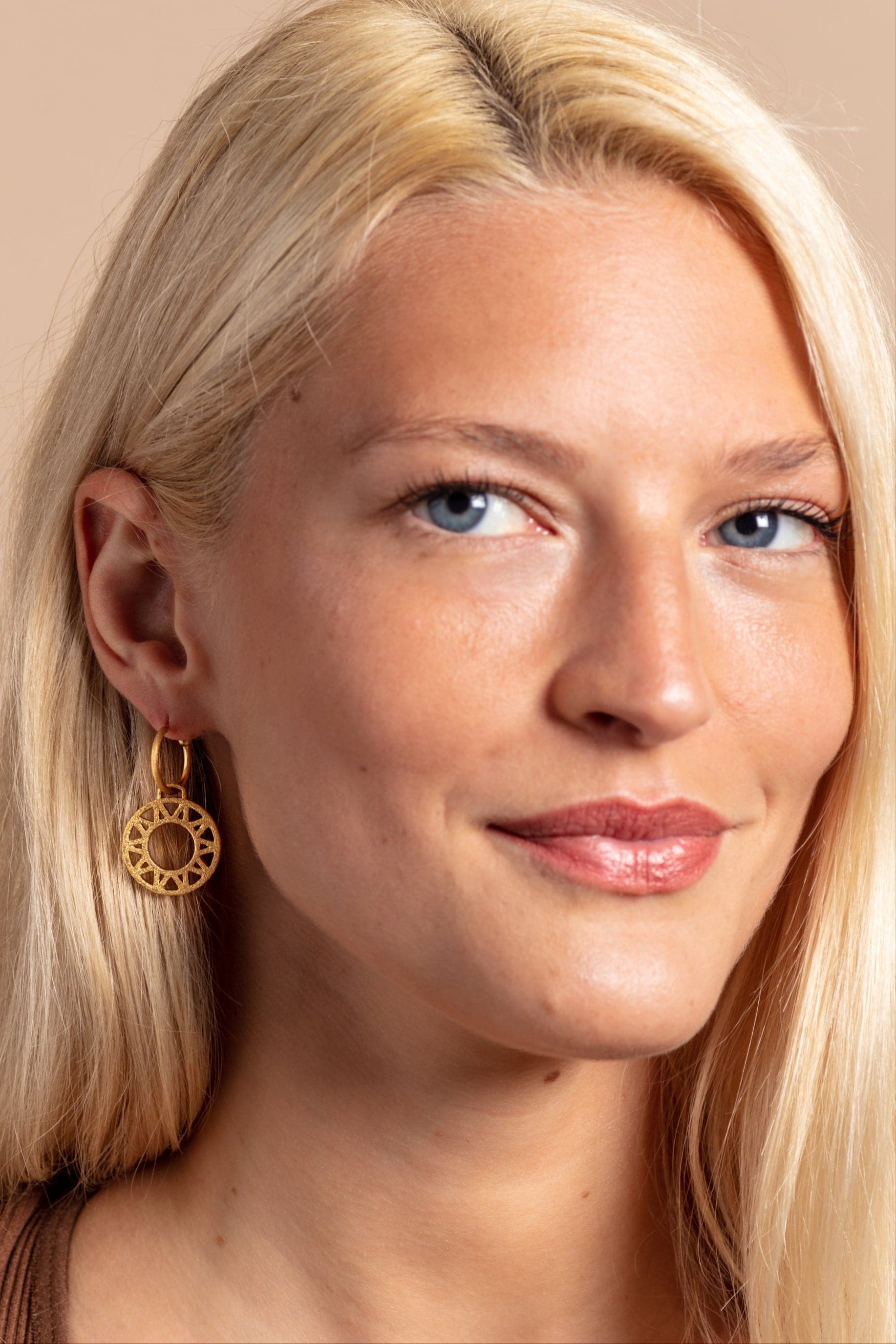 model wears Geometric Statement Gold Hoop Earrings