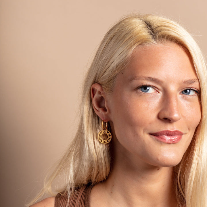 model wears Geometric Statement Gold Hoop Earrings