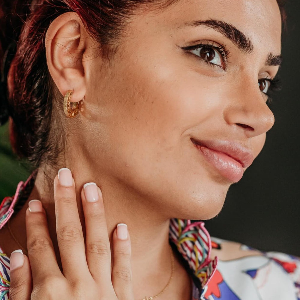 model wears 14k gold vermeil geometric statement hoop earrings