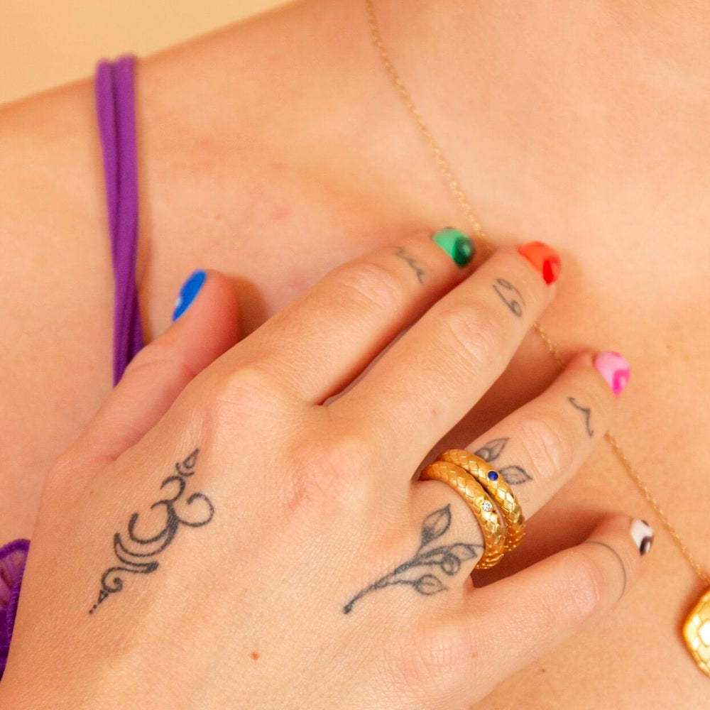 model wears  Lab grown diamond and 14k gold vermeil art deco statement ring and lapis lazuli and 14k gold vermeil art deco statement ring