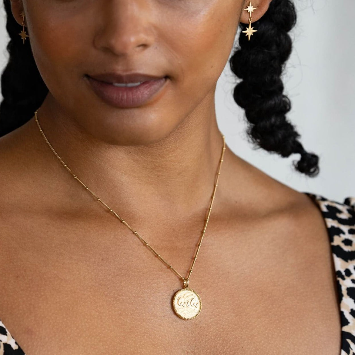 model-wears-14k-gold-vermeil-love-is-love-shorthand-coin-disc-necklace-claire-hill-designs-3