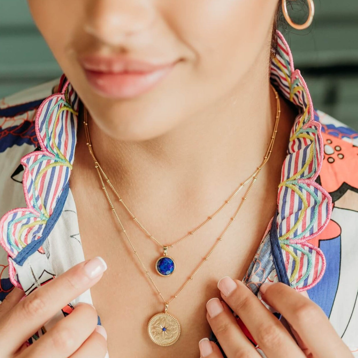 model-wears-14k-gold-vermeil-north-star-pendant-necklace-with-lapis-lazuli--and-lapis-lazuli-gold-vermeil-disc-necklace-claire-hill-designs