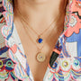 model-wears-14k-gold-vermeil-north-star-pendant-necklace-with-lapis-lazuli--and-lapis-lazuli-gold-vermeil-disc-necklace-claire-hill-designs