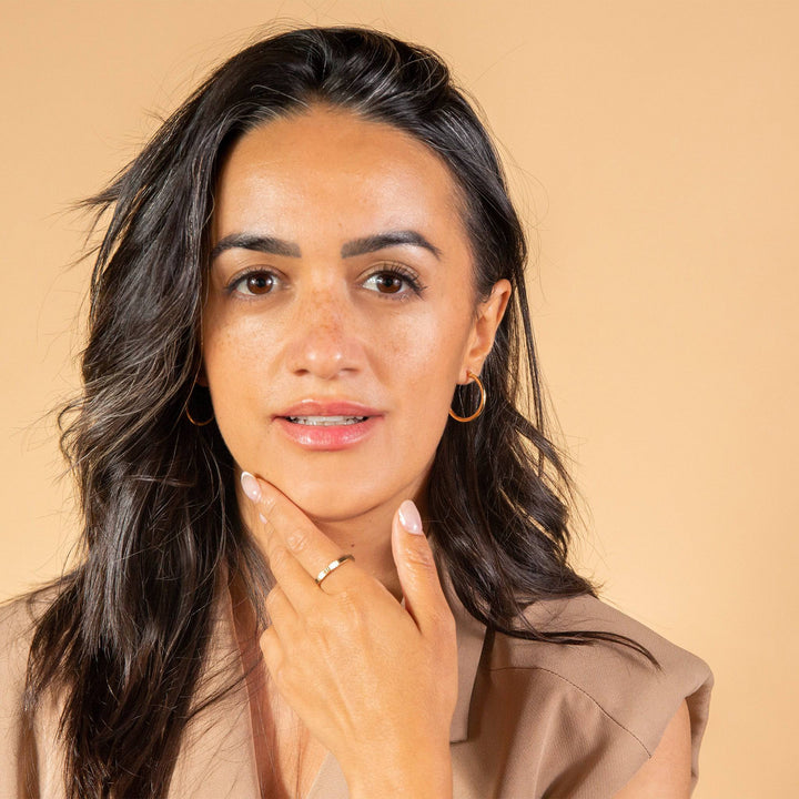 model wears Ridged Gold Stacking Ring