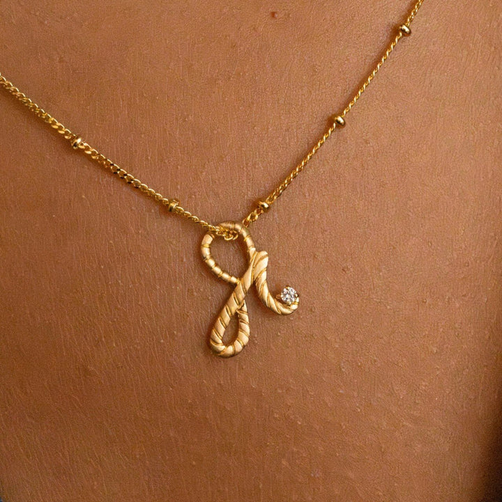 model wears 14k gold vermeil Shorthand charm necklace on satellite chain meaning Fearless -  Claire Hill Designs