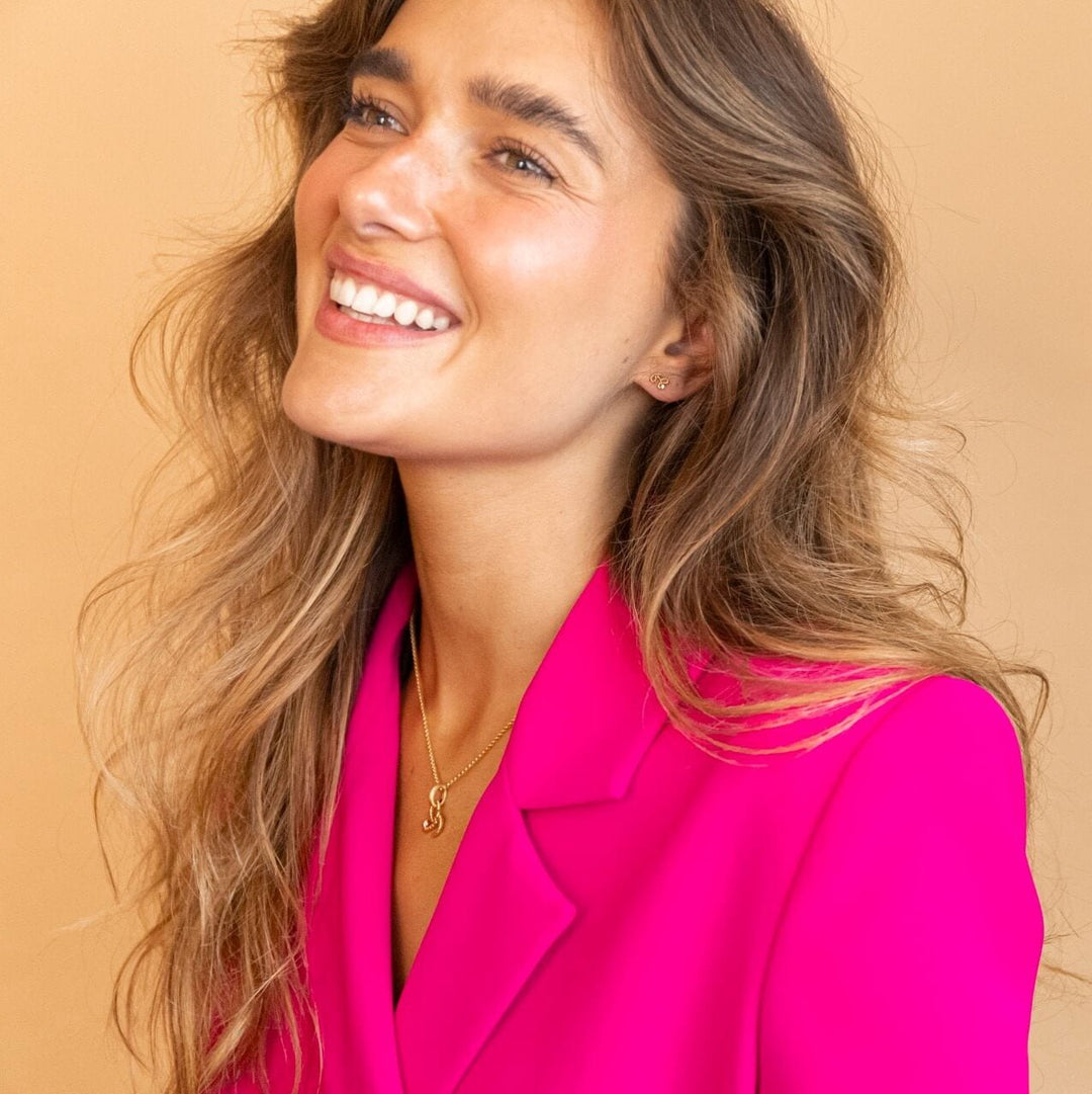 Model wears Beautiful Gold Vermeil Shorthand Stud Earring - Claire Hill Designs 