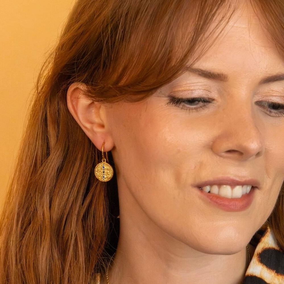 model wears Sapphire Gold Coin Pendant Earrings