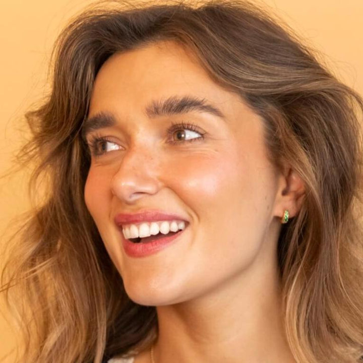 Model wears Emerald and 18k Gold Vermeil Antique Textured Huggie Hoop Earrings - Claire Hill Designs