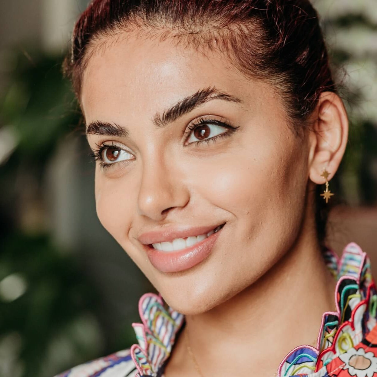 model wears 18k gold vermeil brushed double north star statement stud earrings