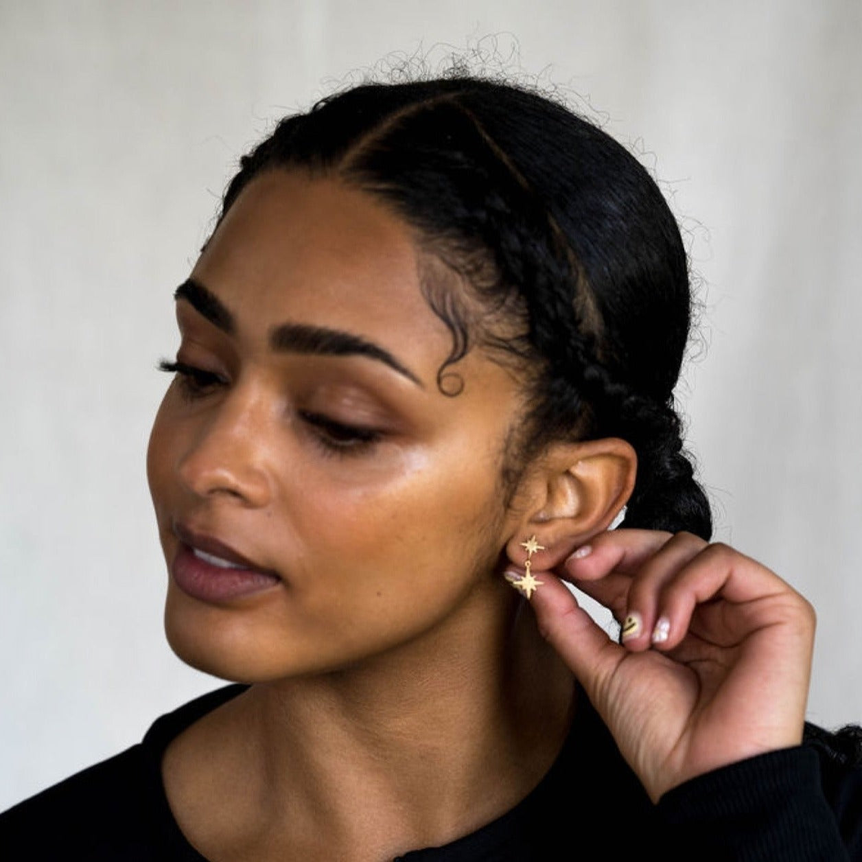 model wears 18k gold vermeil brushed double north star stud earrings 