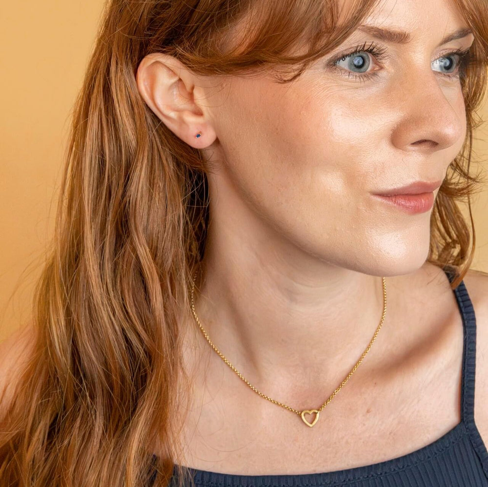 model wears 18k gold vermeil brushed heart connector necklace on rolo chain - Claire Hill Designs