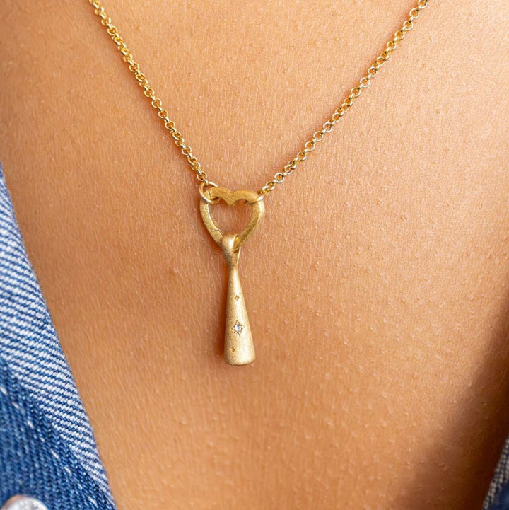 Model wears 18k Gold Vermeil Comet Charm Pendant hanging on Rolo Heart Connector necklace - Claire Hill Designs 