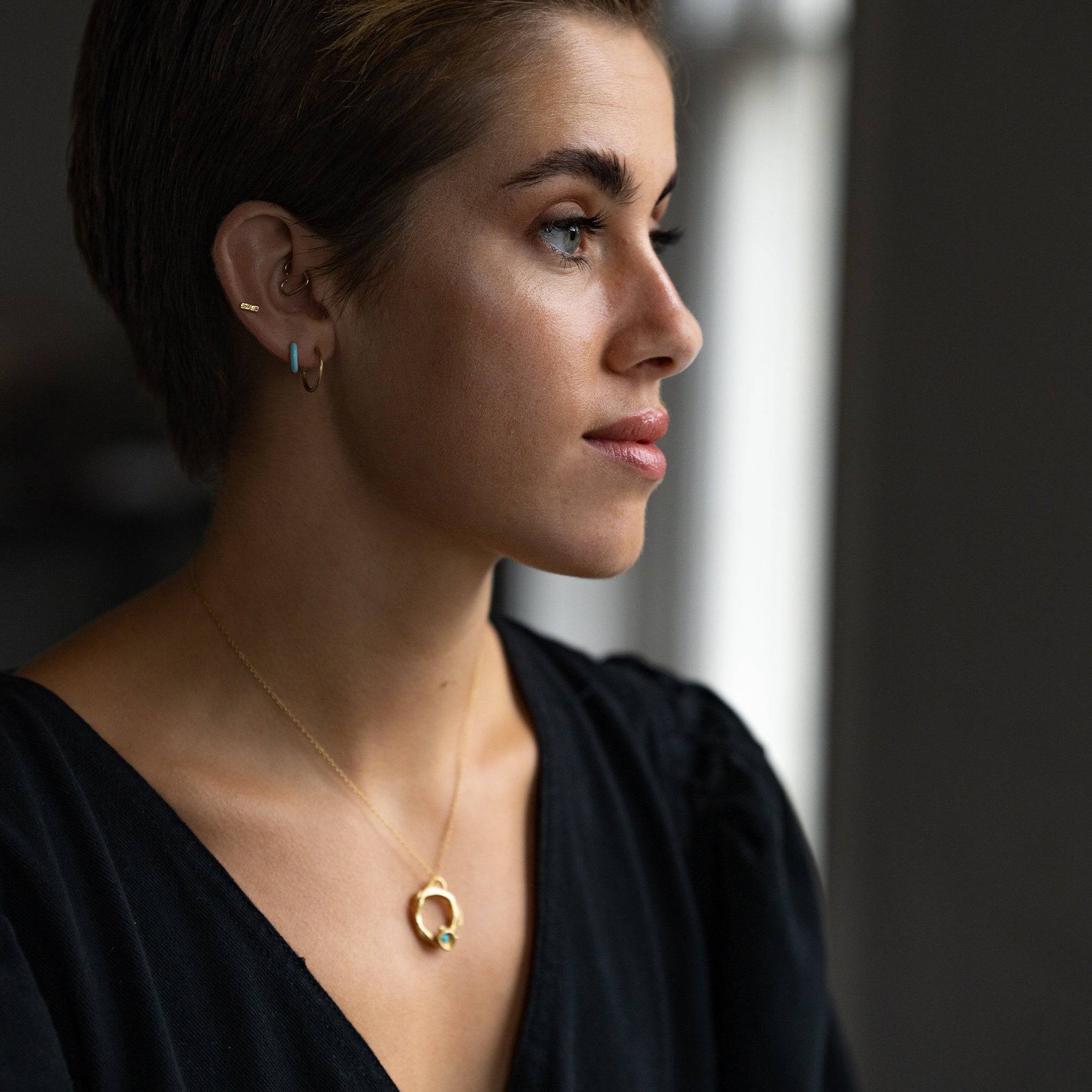 model wears Minimalist Gold Brushed Hoop Earrings
