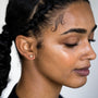 model wears 18k gold vermeil north star stud earrings