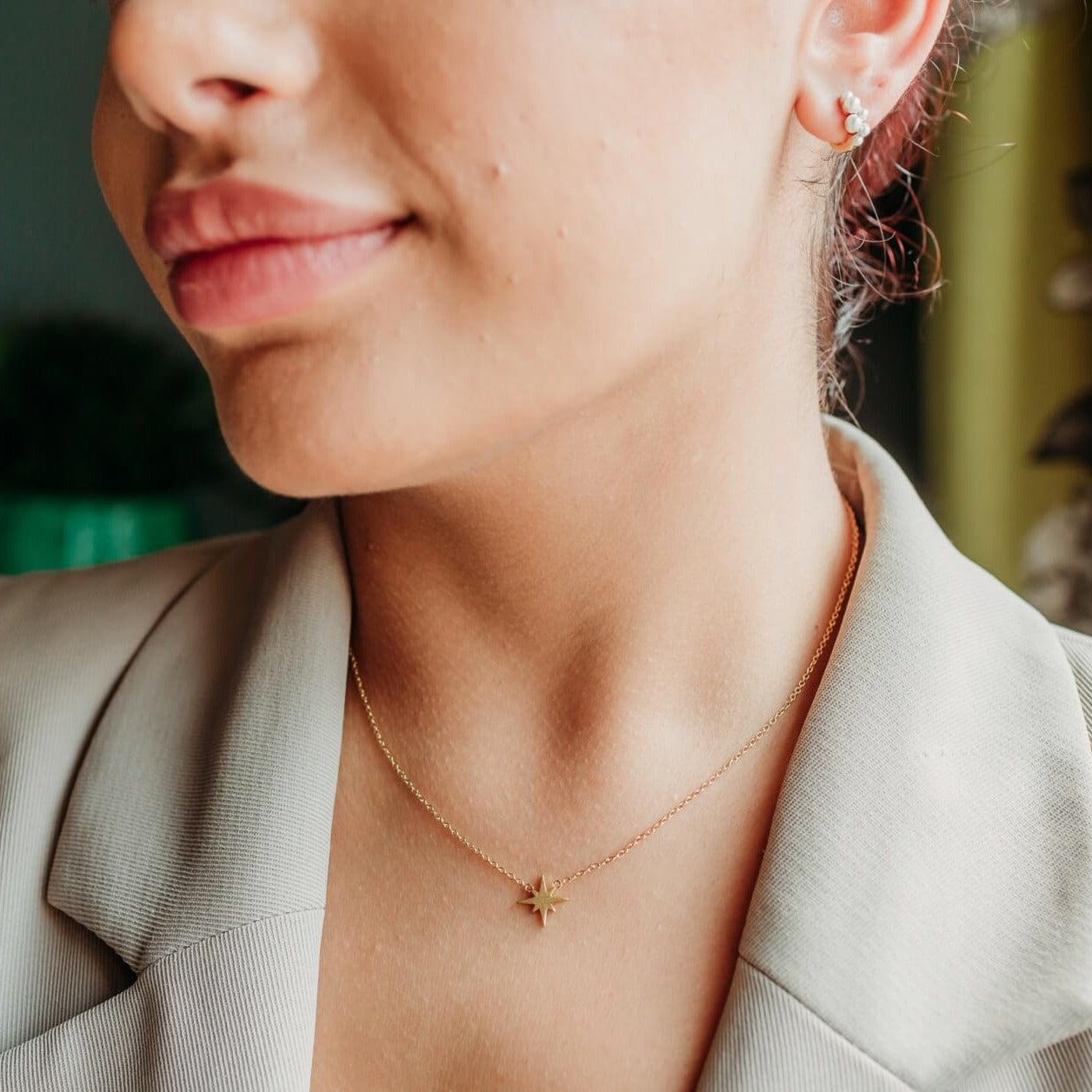 model wears 18k gold vermeil brushed north star dainty necklace and pearl huggie hoop earrings