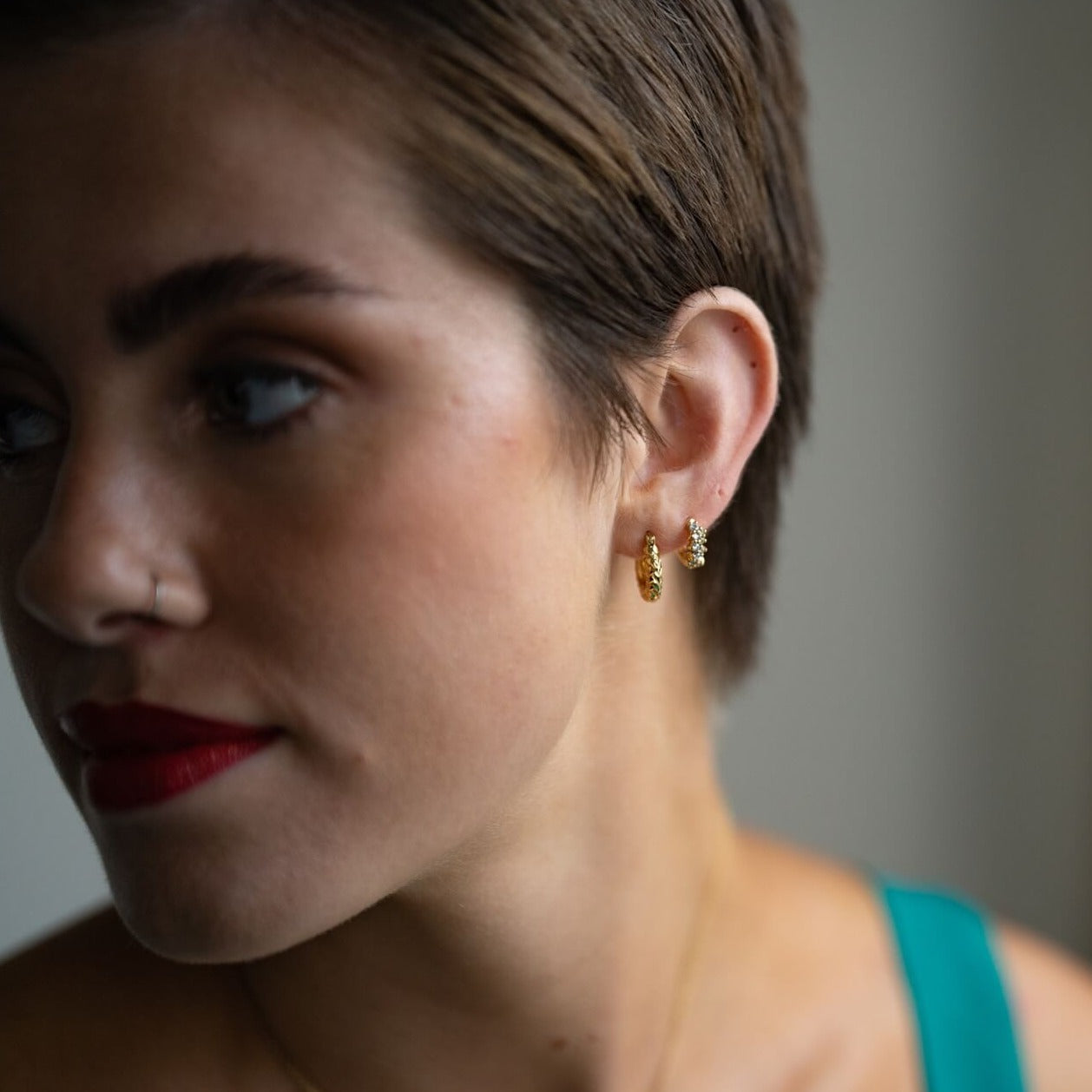 model wears  Chunky diamond cut 18k gold vermeil hoop earrings