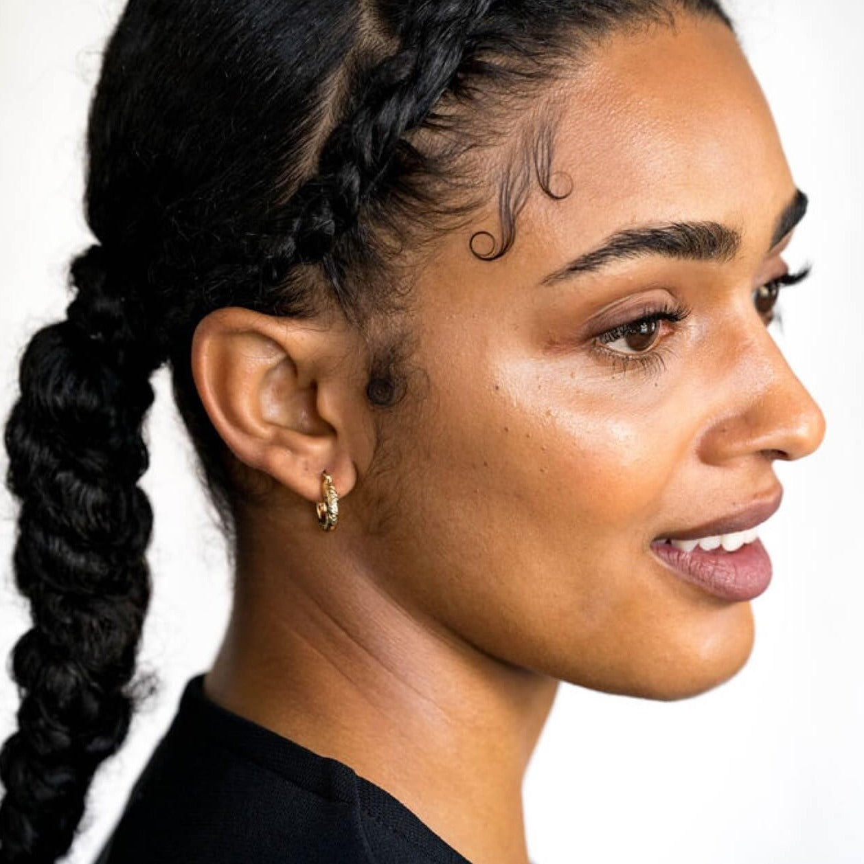 model wears  Chunky diamond cut 18k gold vermeil hoop earrings