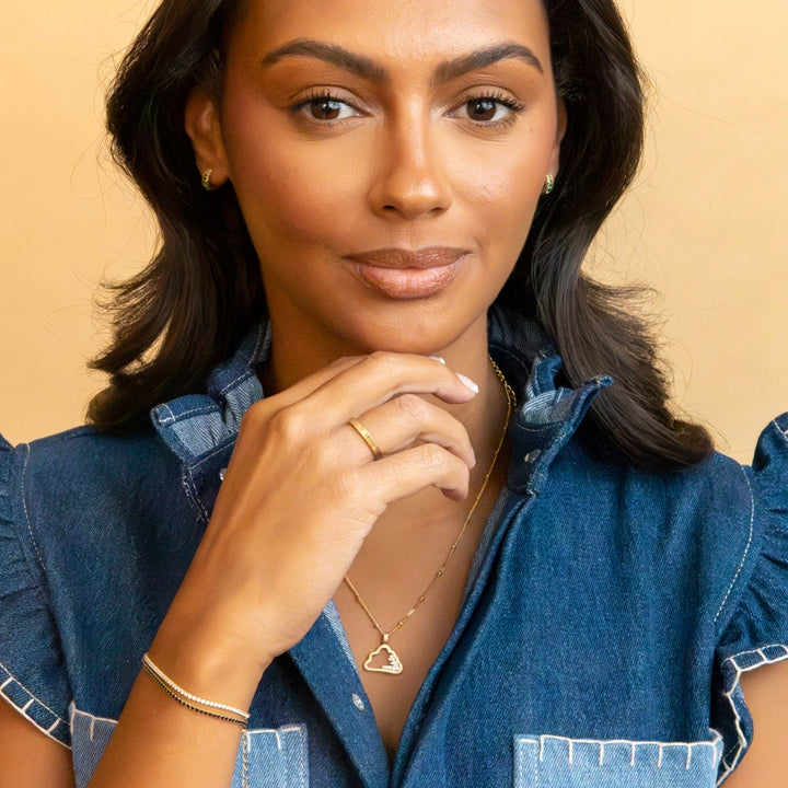 Model wears Black Cubic Zirconia Gold Tennis Bracelet