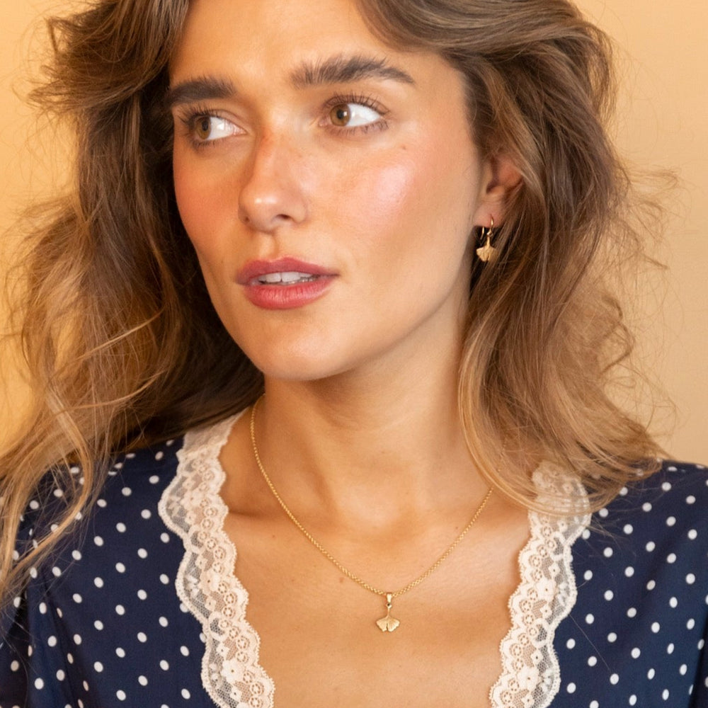 model wears Ginkgo Leaf Gold Charm Necklace