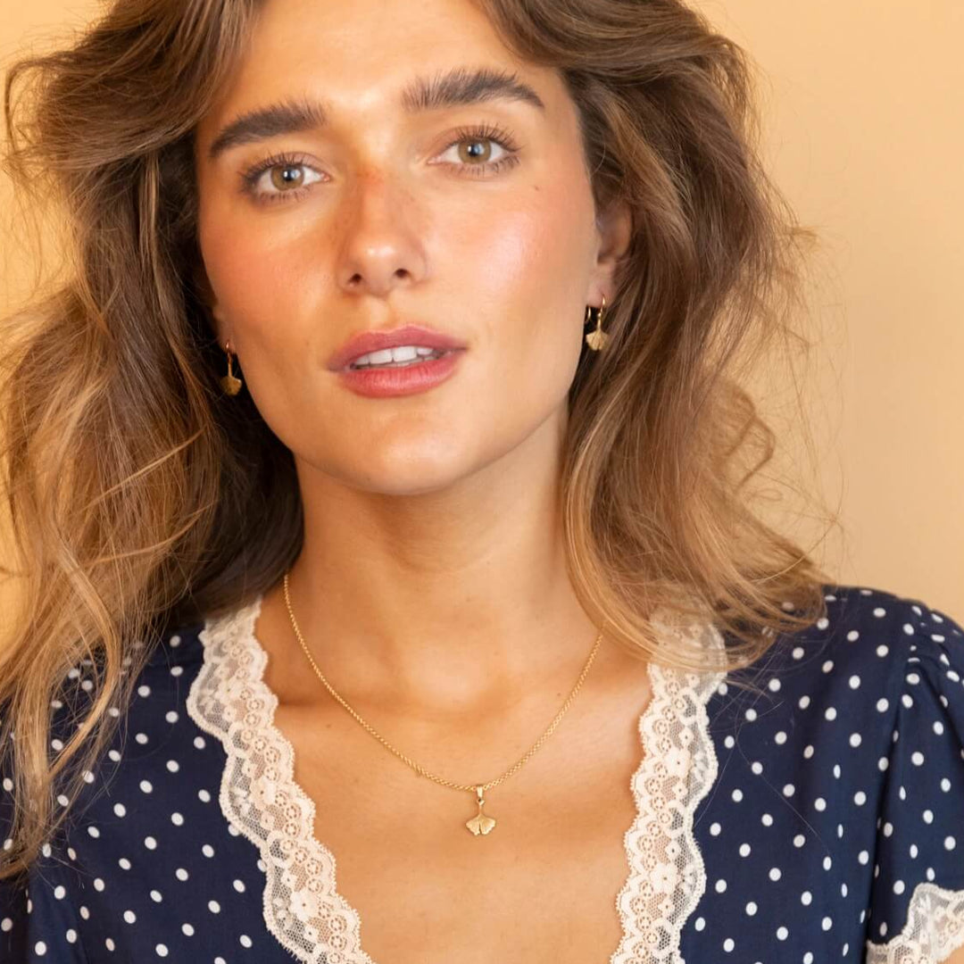 model wears Ginkgo Leaf Gold Charm Necklace
