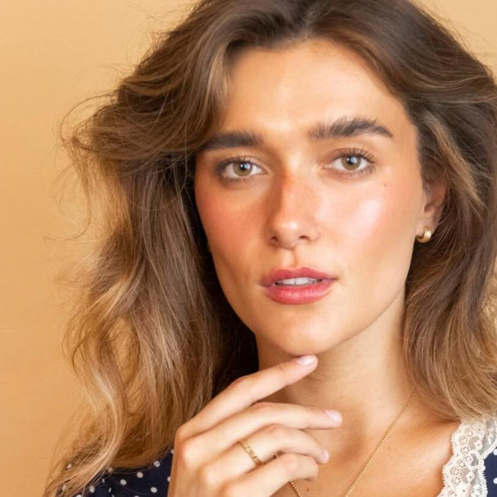 model wears chunky 18k gold vermeil ridged huggie hoop earrings