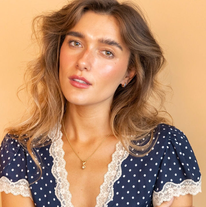 model wears 18k Gold Vermeil Lemon Charm Necklace using heart connector - Claire Hill Designs