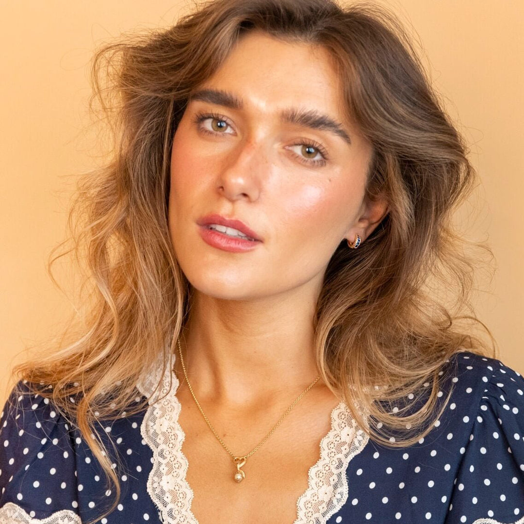 Model wears Sapphire and 18k Gold Vermeil Antique Textured Huggie Hoop Earrings - Claire Hill Designs