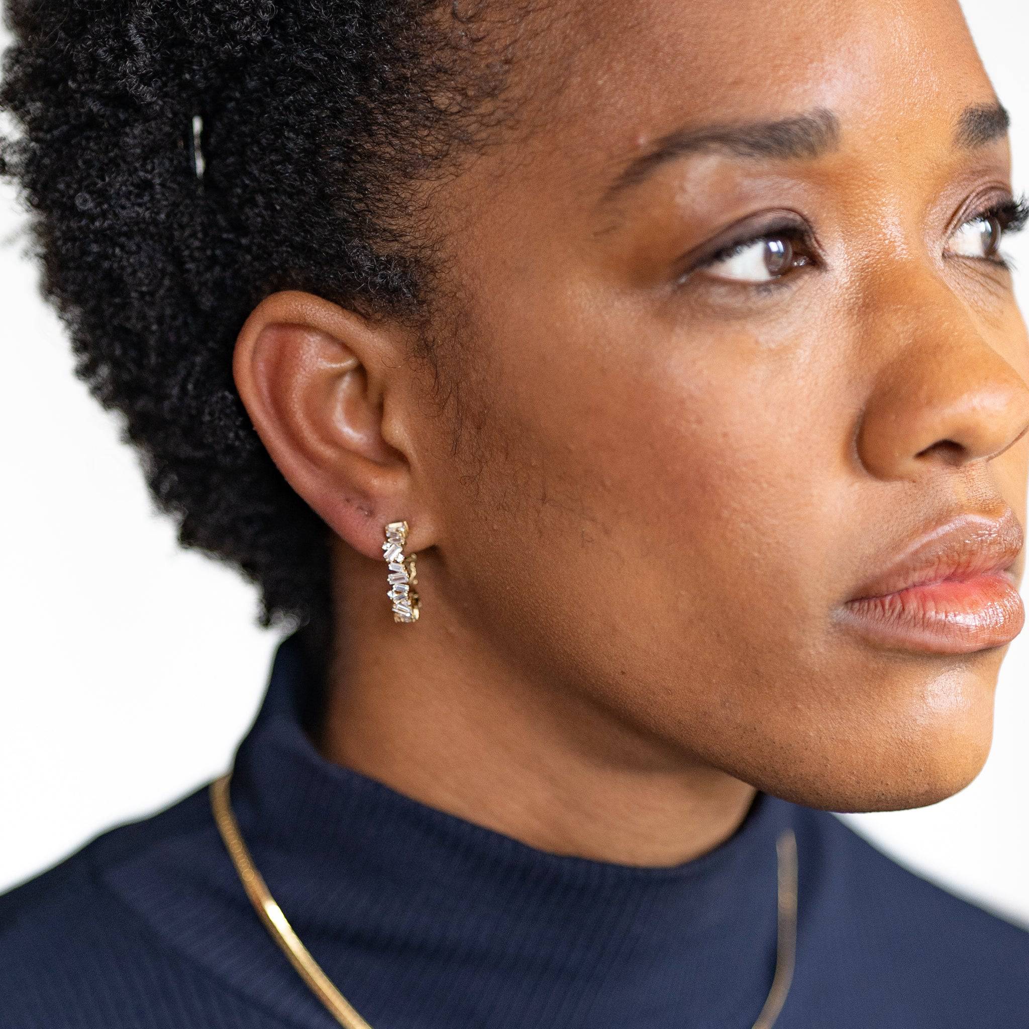 model wears Statement Sparkly Gold Baguette Hoop Earrings (20mm)