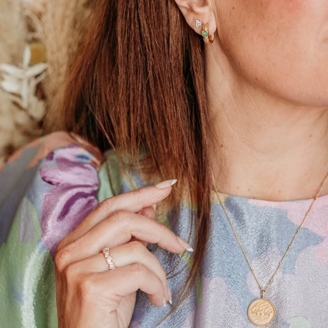 model wears Statement Sparkly Gold Baguette Eternity Ring