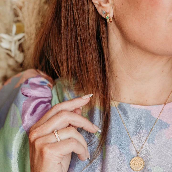 model wears Statement Sparkly Gold Baguette Eternity Ring