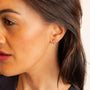 model wears Sparkly Gold Lightning Bolt Stud Earrings 