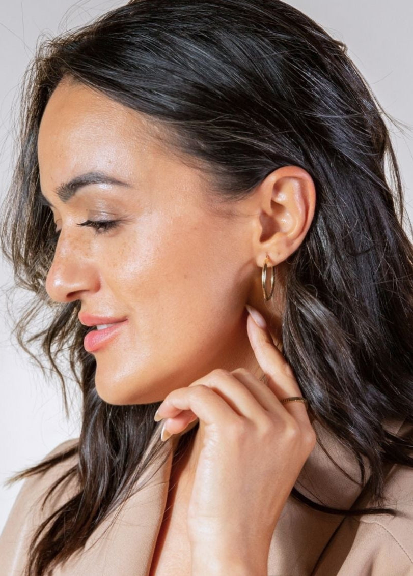 model wears 20mm 9ct solid gold hoop earrings