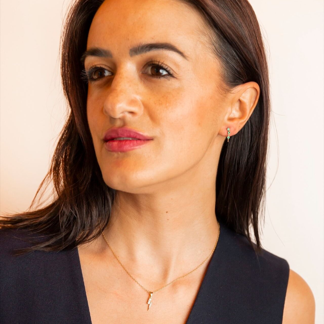 model wears Emerald 9ct Solid Gold Chain Stud Earrings