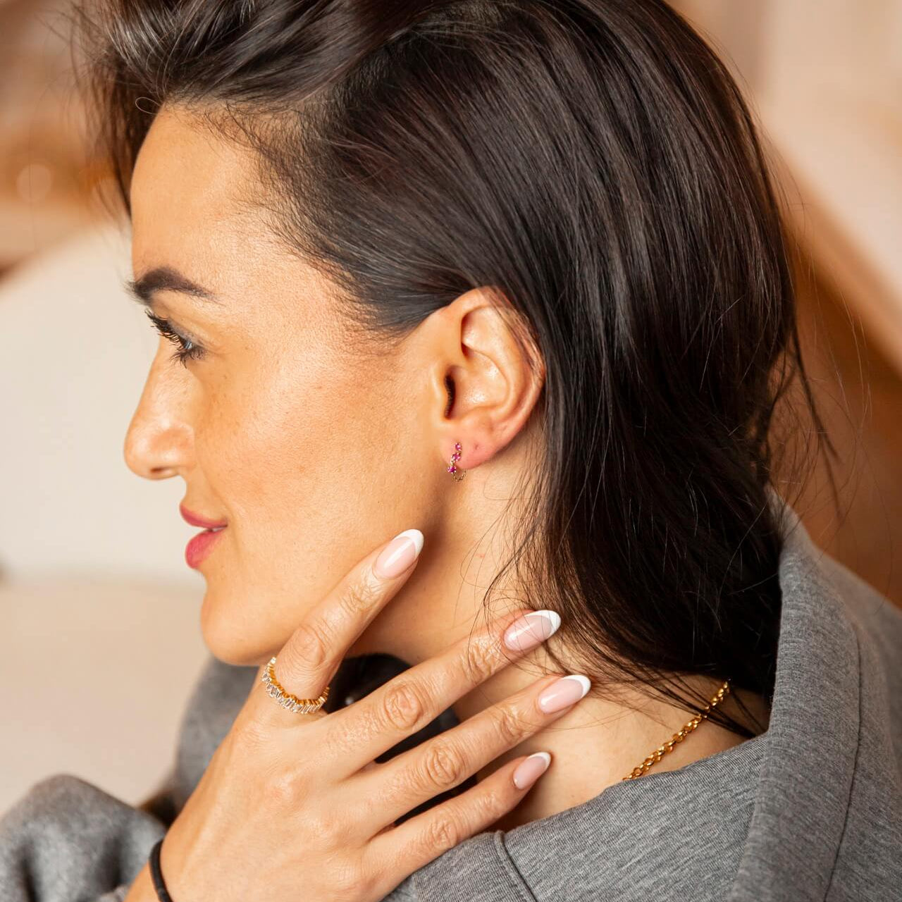 model wears Pink Ruby 9ct Solid Gold Chain Stud Earrings