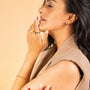 model wears 9ct Solid Gold Hoop Earrings (15mm)