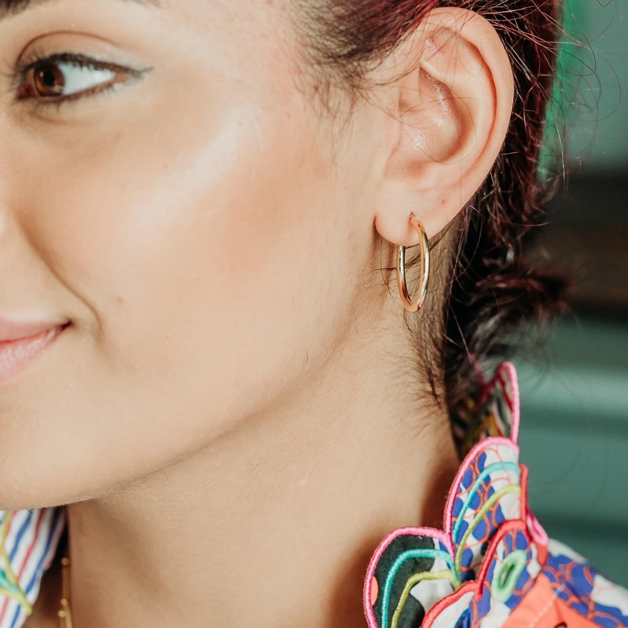 model wears Large 9ct Solid Gold Hoop Earrings (20mm)