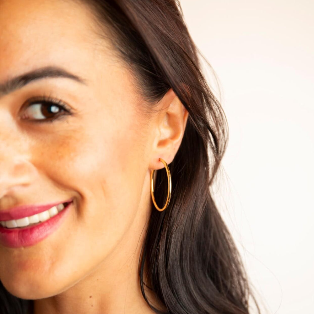 model wears 9ct Solid Gold 30mm Hoop Earrings - Claire Hill Designs - close up