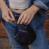 Model holds navy Claire Hill embroidered baseball cap