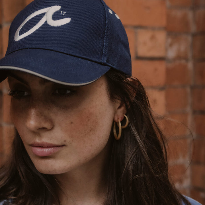 Model wears navy Fuck It Shorthand embroidered baseball cap